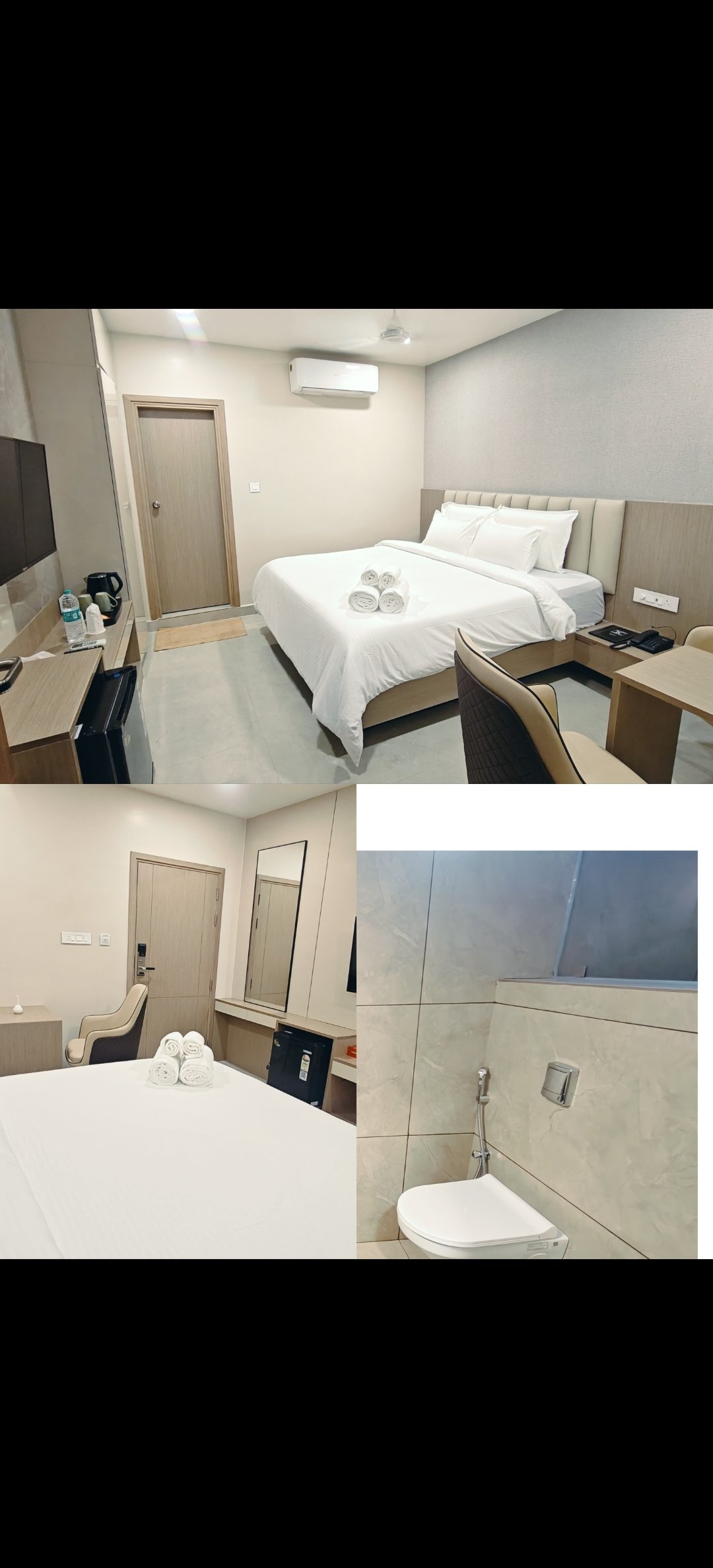 Executive room interior showing a neatly made double bed with white linens, wooden furniture, and air conditioning unit